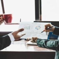 Business team analyzing income charts and graphs. Close up. Business analysis and strategy concept.