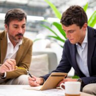 low-angle-male-coworkers-meeting-office